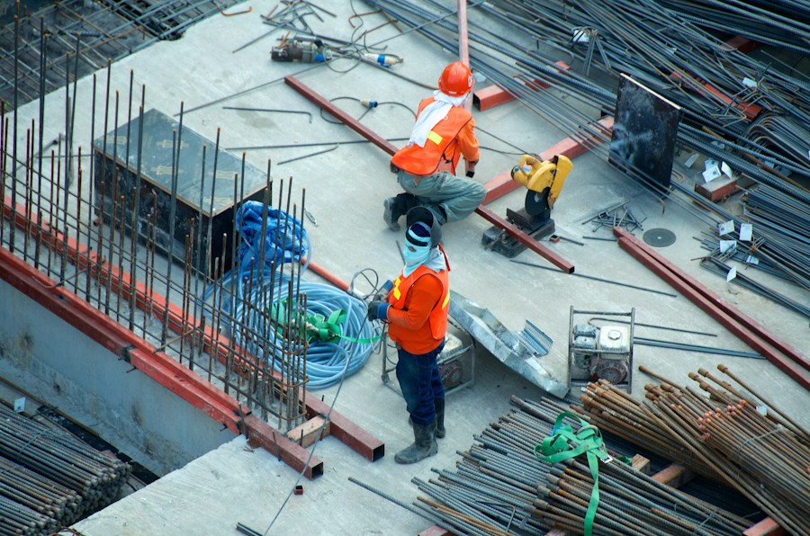 Construction workers preparing a reinforced building structure